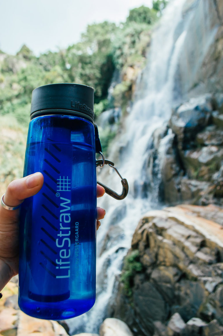 lifestraw go water bottle in front of waterfall