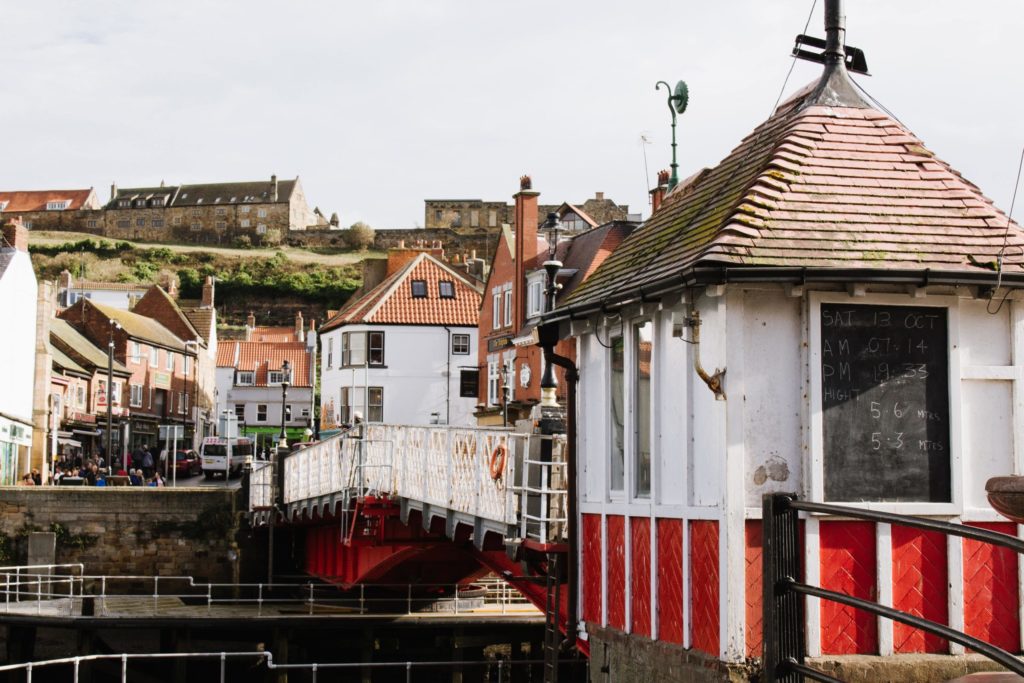 historic buildings and white bridge in Whitby