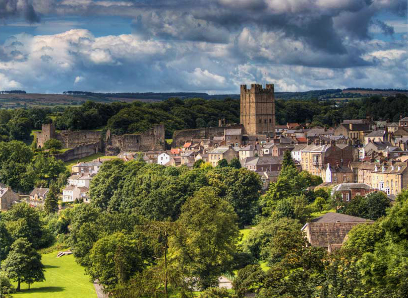 richmond castle and town with trees in foreground