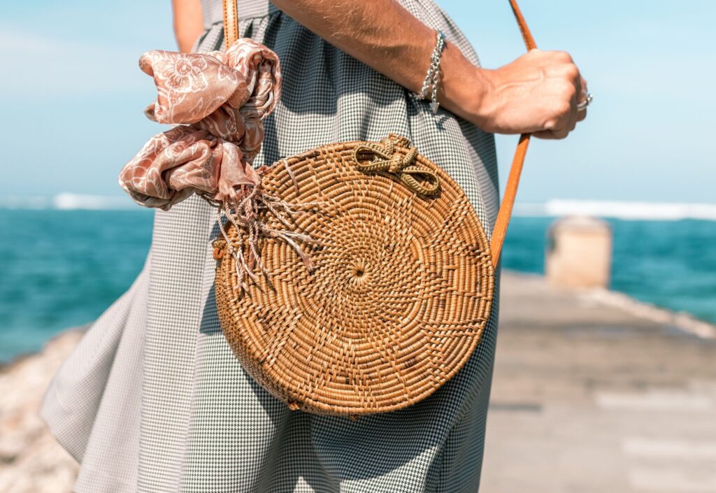lady on beach with basket bag