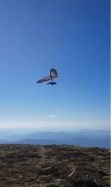 a paraglider at the top of mount bogong