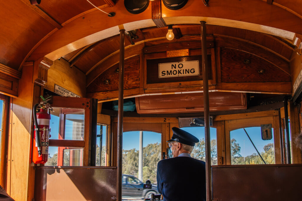 tram driver sat on vintage tram in bendigo